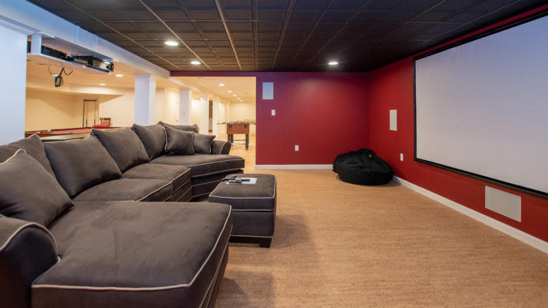 Large living space with couch and screen